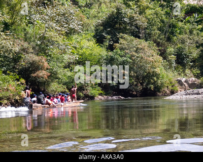 A group of tourists travel to the Embera Drua village on a dugout canoe Stock Photo