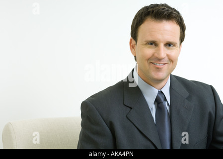 Businessman smiling at camera, portrait Stock Photo
