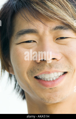 Man smiling at camera, cropped portrait Stock Photo