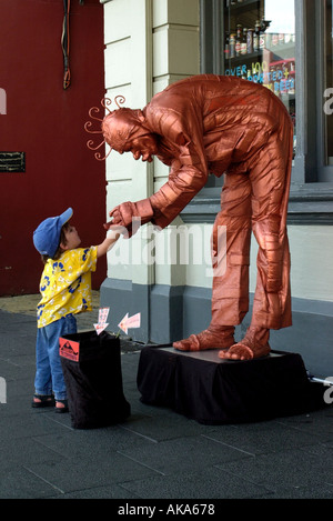 Street theater with clown and child Stock Photo
