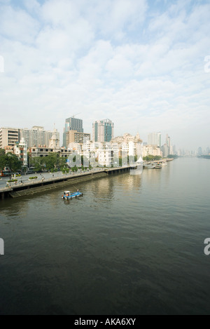 China, Guangdong Province, Guangzhou, cityscape seen from water Stock Photo