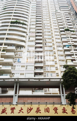 China, Guangdong Province, Guangzhou, facade of high rise apartment building Stock Photo