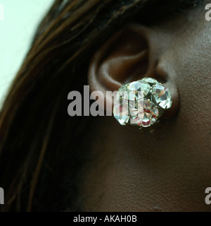 Close Up of Earring in an Black Womans Ear Stock Photo