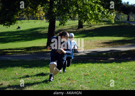 Women practice flag football on Gaelic Field in Inwood Hill park Stock Photo