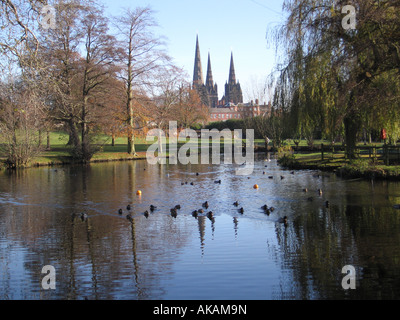 Lichfield Cathedral seen from Beacon Park Lichfield Staffordshire England The cathedral is reflected in the park pool Stock Photo