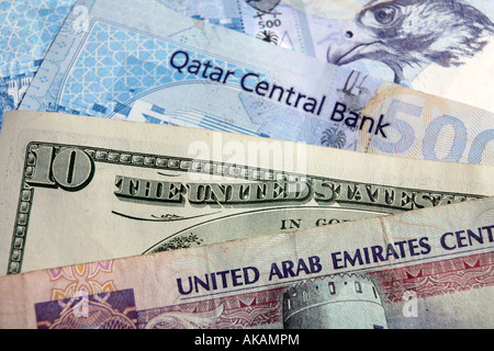 A high value Qatari and United Arab Emirates banknotes with the US currency Stock Photo