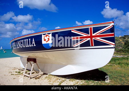 Flag of Anguilla with British union jack and coat of arms painted on local boat on beach in Road Bay Anguilla Caribbean Stock Photo