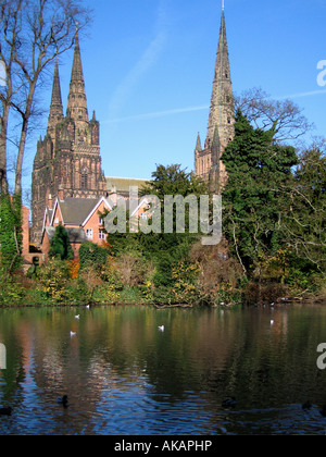 Lichfield Cathedral seen across Minster Pool with reflections Lichfield Staffordshire England Stock Photo