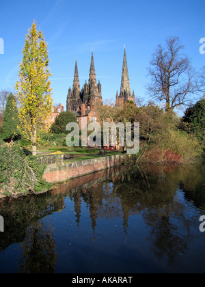 Lichfield Cathedral seen across Minster Pool with reflections Lichfield Staffordshire England Stock Photo