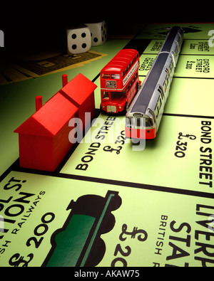 London Transport and Monopoly Board Monopoly and routemaster bus with underground train on Bond Street next stop Liverpool St. Stock Photo