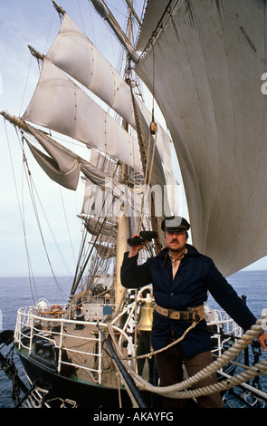 A Russian sailor lookout on deck of tall ship Stock Photo