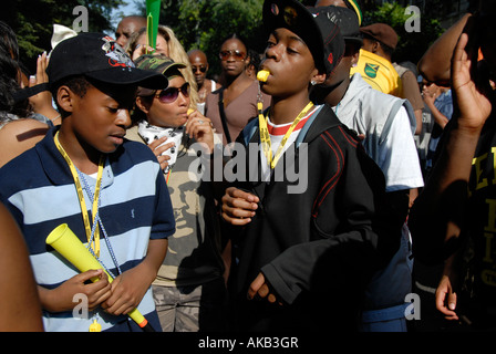 gang of lively young lads mucking about in streets of Notting Hill west london at carnival time. Stock Photo