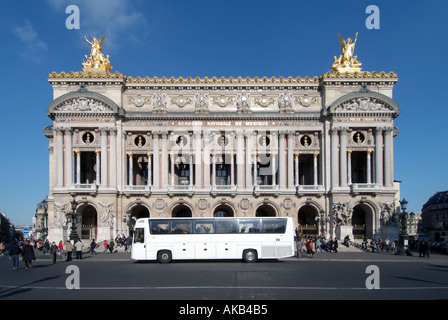 Paris Place de Opera sightseeing coach outside Charles Garniers Opera House Stock Photo