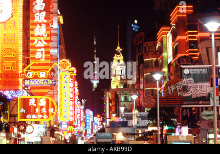Neon light signs lit up at night on Nanjing Lu Road in the city of Shanghai in China Stock Photo