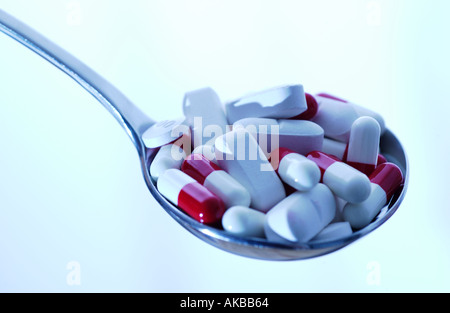 Spoonful of pills Stock Photo