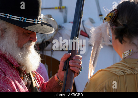 Mountain Man and Native American Women at a reenactment in Wisconsin Stock Photo