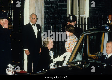 HM Queen Elizabeth II is greeted by Prime Minister Margaret Thatcher at 10 Downing Street on 4 December 1985 The husband of the Prime Minister, Denis Stock Photo