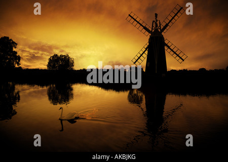 Turf Fen Mill at sunset reflected in the River Ant, Norfolk Broads, UK Stock Photo