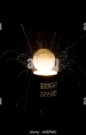 Bright sparks. Punched holes in a Tin can and a firework at night on a long exposure Stock Photo