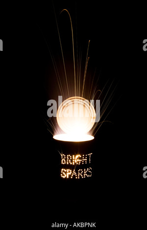 Bright sparks. Punched holes in a Tin can and a firework at night on a long exposure Stock Photo