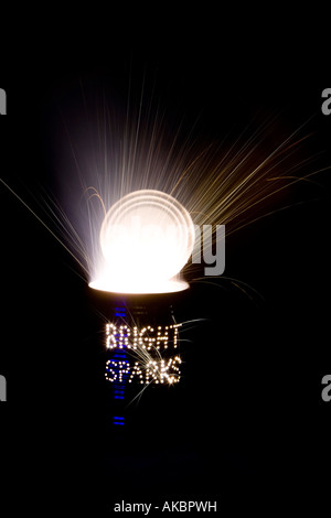 Bright sparks. Punched holes in a Tin can and a firework at night on a long exposure Stock Photo