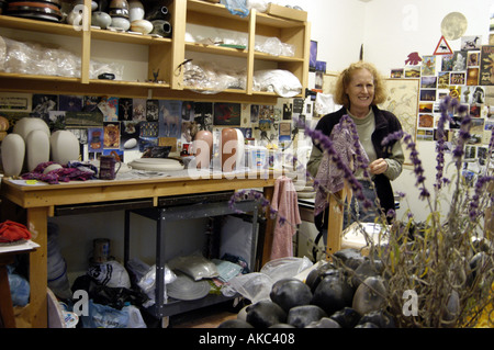 Potter showing work in studio Stock Photo