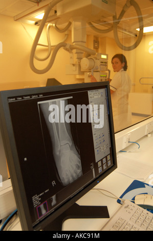 A radiographer uses new technology to take xrays of a patient at a Hospital in Leeds, West Yorkshire. Stock Photo