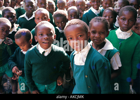 A large group of Primary School children dressed in green school uniforms in Nairobi Kenya East Africa Stock Photo