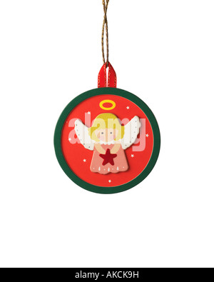 Vintage Christmas ornament decoration of handmade angel with halo scene hanging on hook Stock Photo