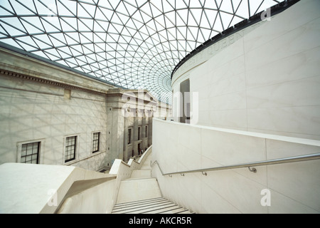The glass roof of the British Museum and the stairway descending around the Reading Room of the Great Court. London, England.