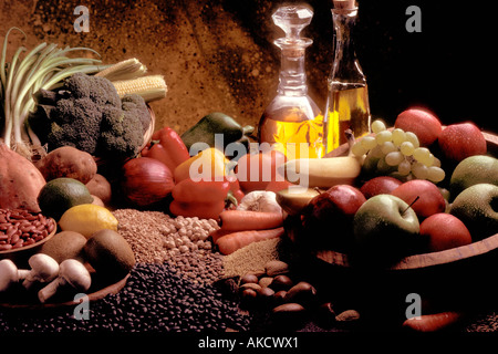 Collection of healthy foods including olive oils, vegetables, mushrooms, lentils and various fruits Stock Photo