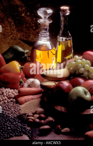 Collection of healthy foods including olive oils, vegatables, mushrooms, lentils and various fruits Stock Photo