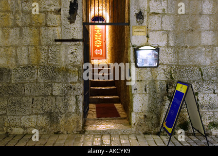 South-East Europe, Croatia, Porec, Dekumanus main street, narrow entrance to restaurant Stock Photo