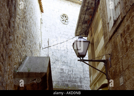 South-East Europe, Croatia, Dalmatia, Trogir, medieval stone walls with modern lamp, low angle view Stock Photo