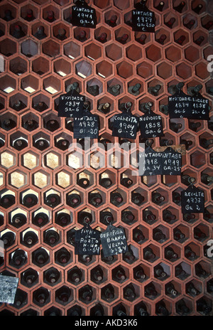 Vintage bottles of wine in rack in cellar of port wine maker Oporto Portugal Stock Photo