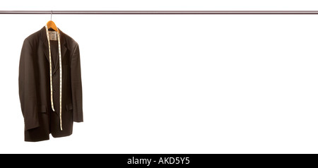 Panoramic shot of suit hanging on really long rail with tailors tape measure