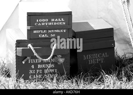 Wooden boxes stacked up against a tent at a civil war encampment reenactment Stock Photo