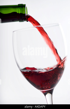 red wine being poured into glass Stock Photo