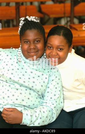 Happy black teen friends age 14 and 12  at community youth center. St Paul Minnesota USA Stock Photo