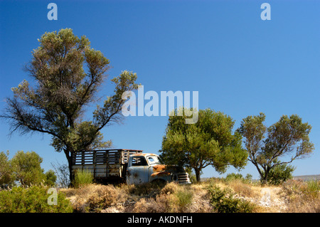 Old abandoned Opel Pick up truck standing in the fields, greece Stock Photo