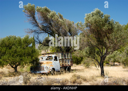 Old abandoned Opel Pick up truck standing in the fields, greece Stock Photo