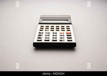 Old fashioned calculator on white background, studio shot Stock Photo