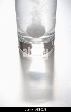 Tablet dissolving in glass of water Stock Photo