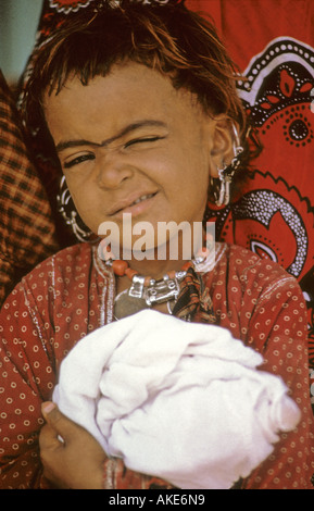 Cheeky Girl and White Bundle, Oman Stock Photo
