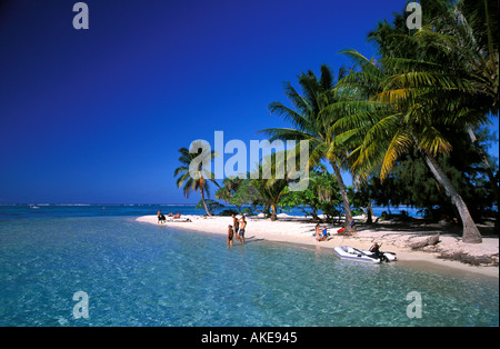 Only a few sunbathers on empty small island beach South Pacific Stock Photo