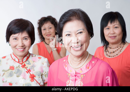 Portrait of three senior women and a mature woman smiling Stock Photo