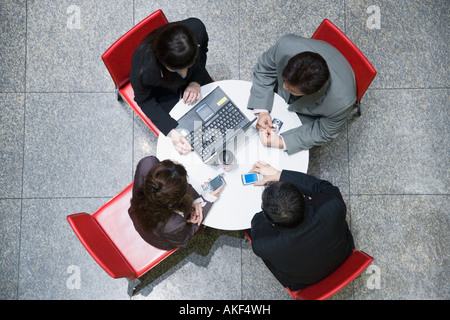 High angle view of two businesswomen with two businessmen in a conference room Stock Photo