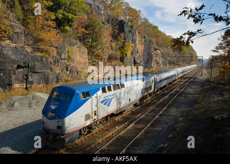 Amtrak passenger train westbound through Little Falls upstate New York Mohawk Valley Stock Photo