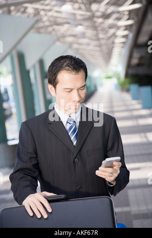 Businessman using a palmtop Stock Photo