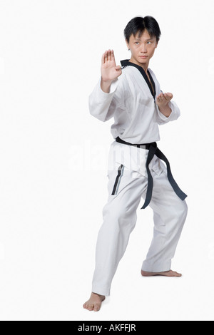 Mid adult man in fighting stance Stock Photo
